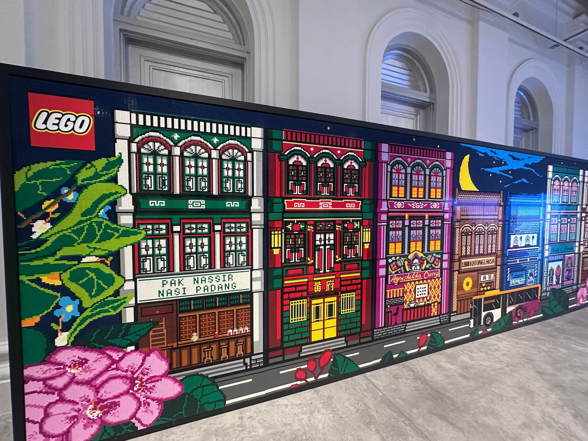 Massive colorful LEGO Shophouse Mural featuring Singapore cultural elements including orchids and traditional shophouse designs