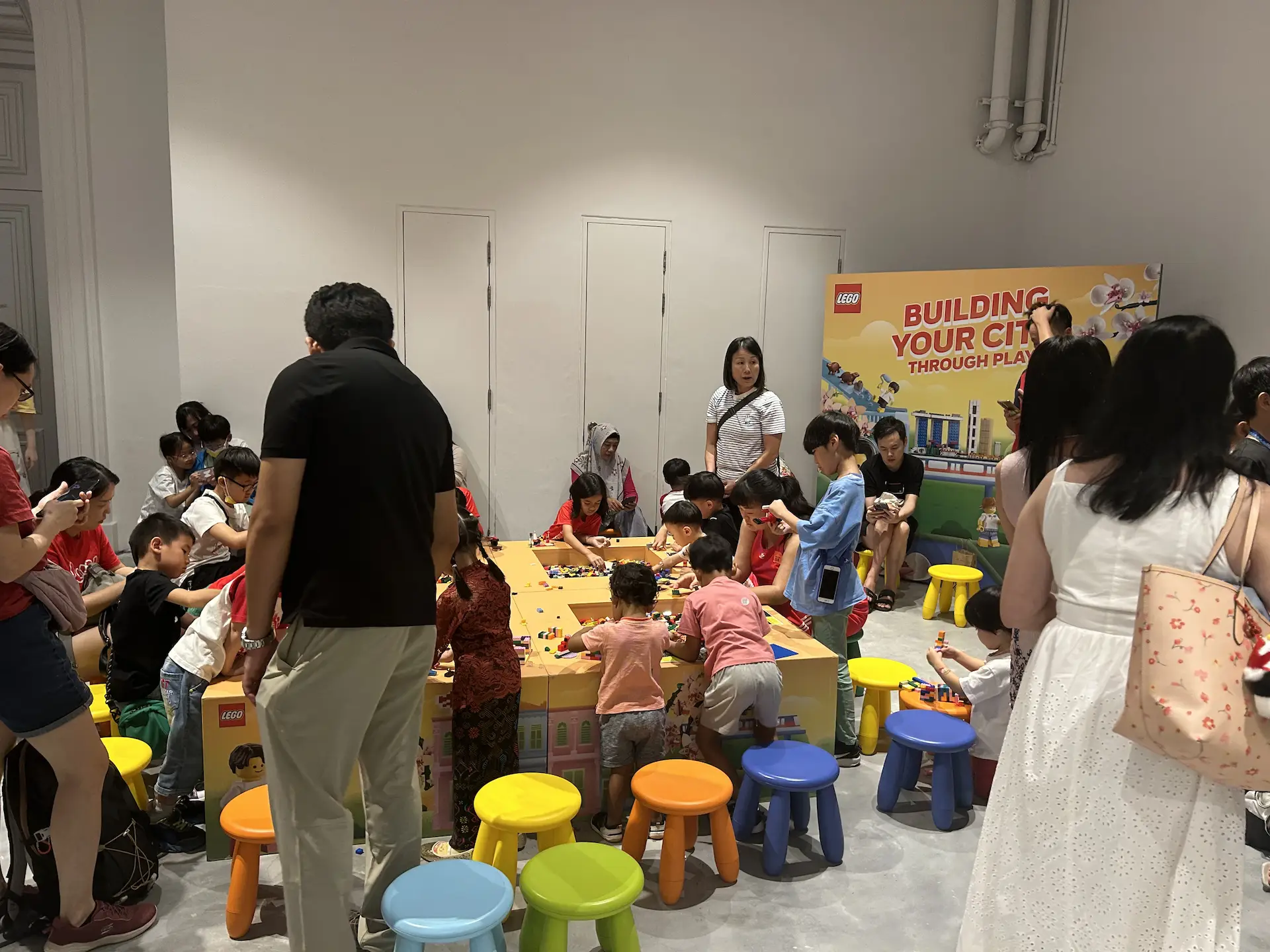 Children and families building with LEGO bricks in the interactive play zone at the National Museum